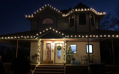 Bright christmas lights on house at night